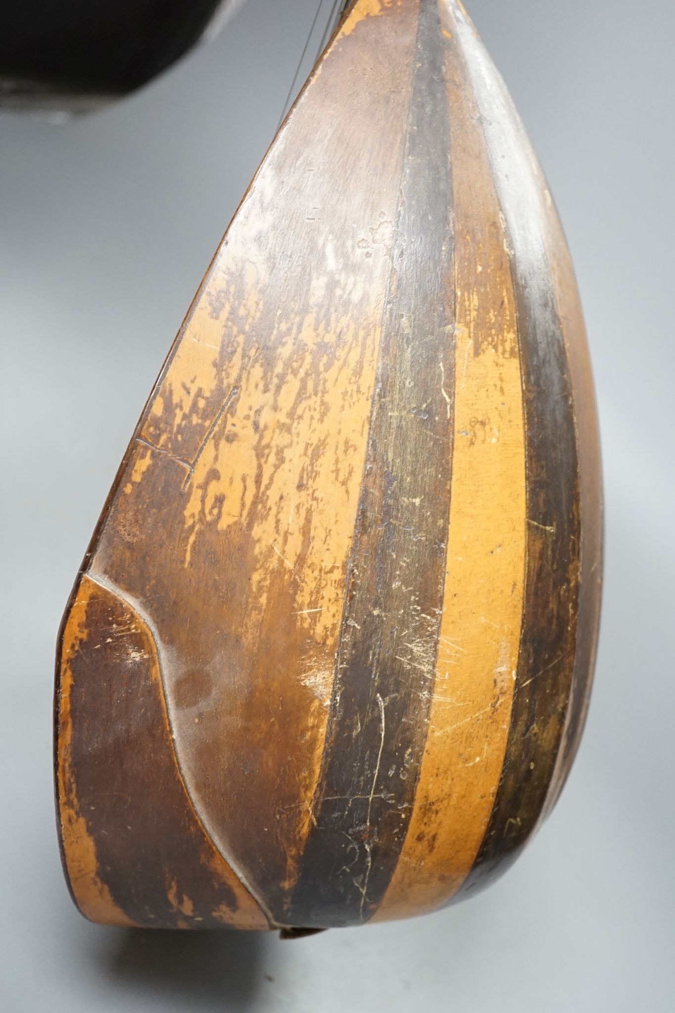 A rosewood and boxwood mandolin with bone pegs, circa 1900